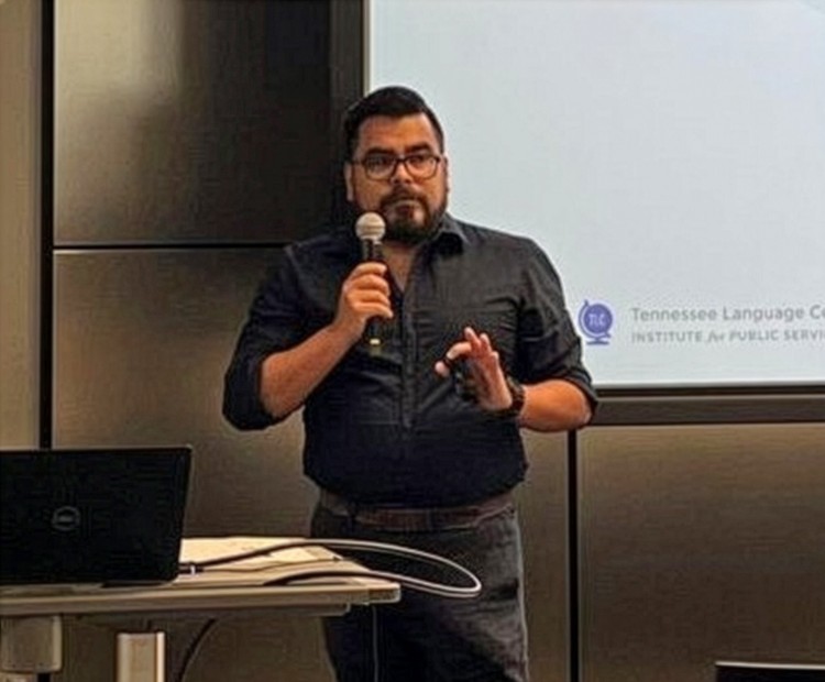 TLC's Richard Ponce-de-Leon gives a presentation in front of a screen.