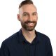 Staff headshot of Eric Amos