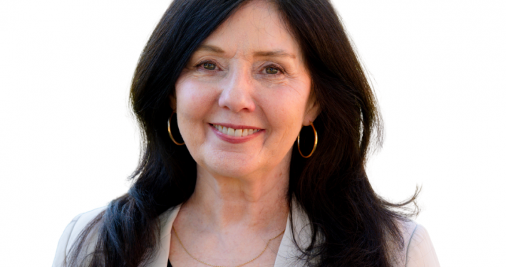 Headshot of a woman with long dark hair